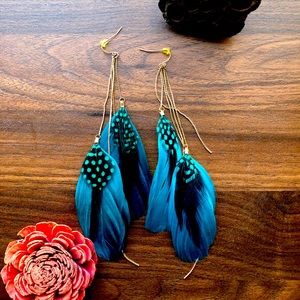 Feather earrings with metal accents